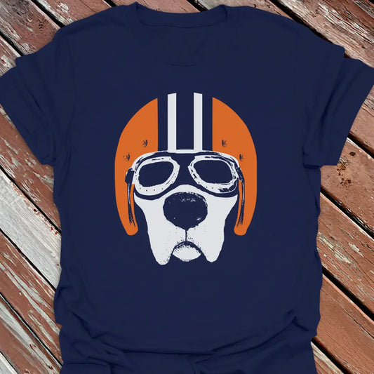 Navy blue road dog t-shirt with a labrador wearing goggles and an orange helmet graphic on a wooden surface.