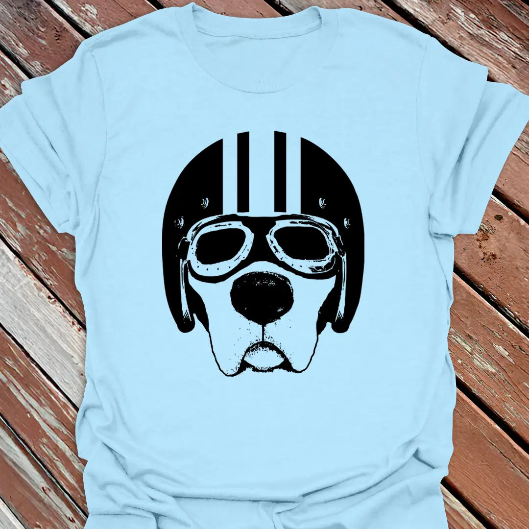 Light Blue road dog t-shirt with a black graphic of a labrador wearing goggles and a helmet on a wooden surface.