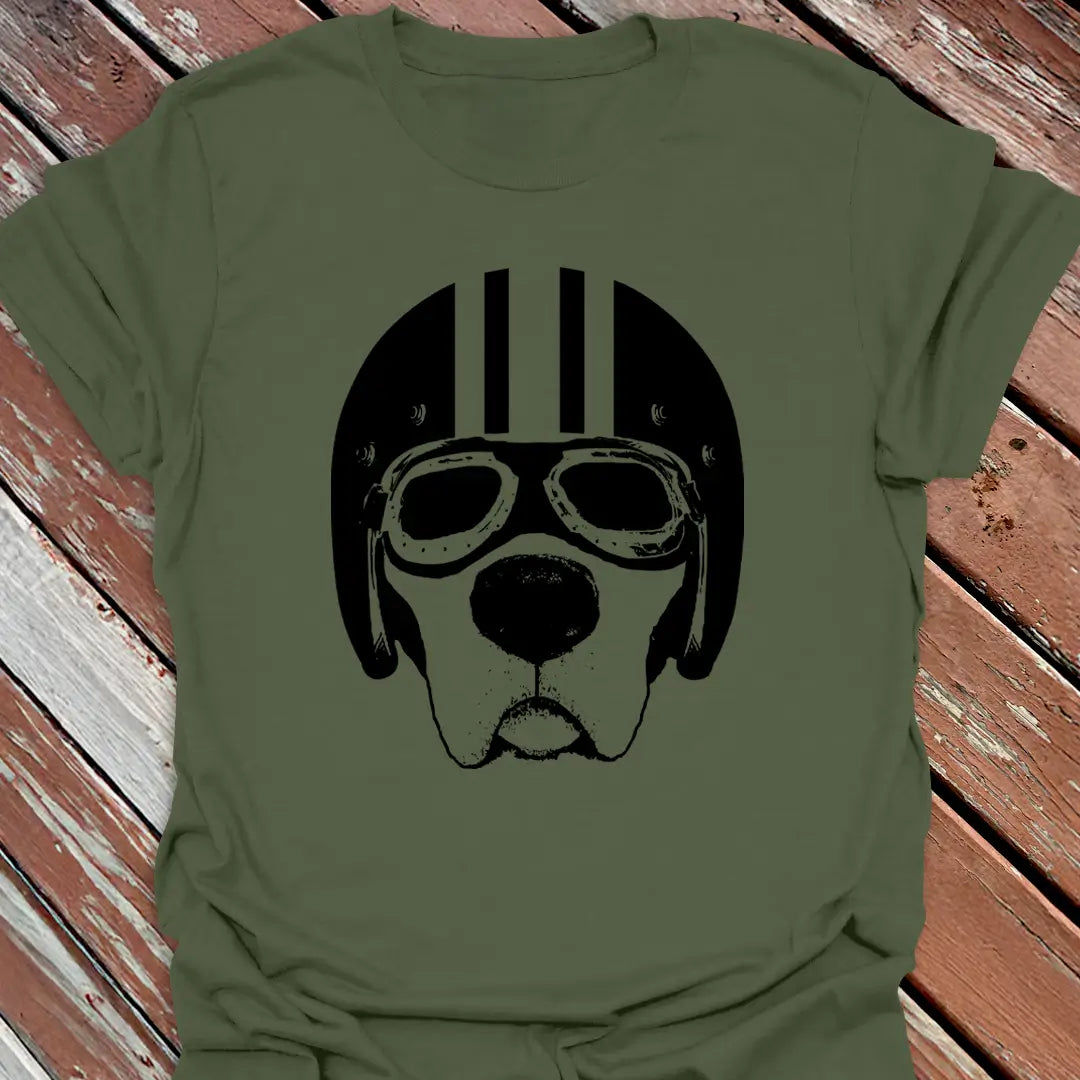 Military Green road dog t-shirt with a black graphic of a labrador wearing goggles and a helmet on a wooden surface.