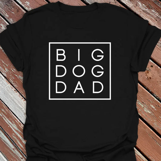 Big Woofer Wear black “Big Dog Dad” T-shirt for large breed dads, boxed text design on wood background