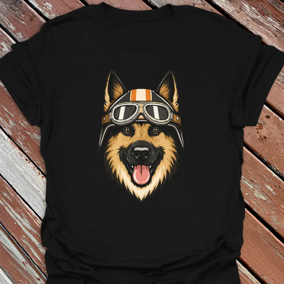 Black t-shirt with a German Shepherd dog wearing a helmet and goggles on a wooden surface