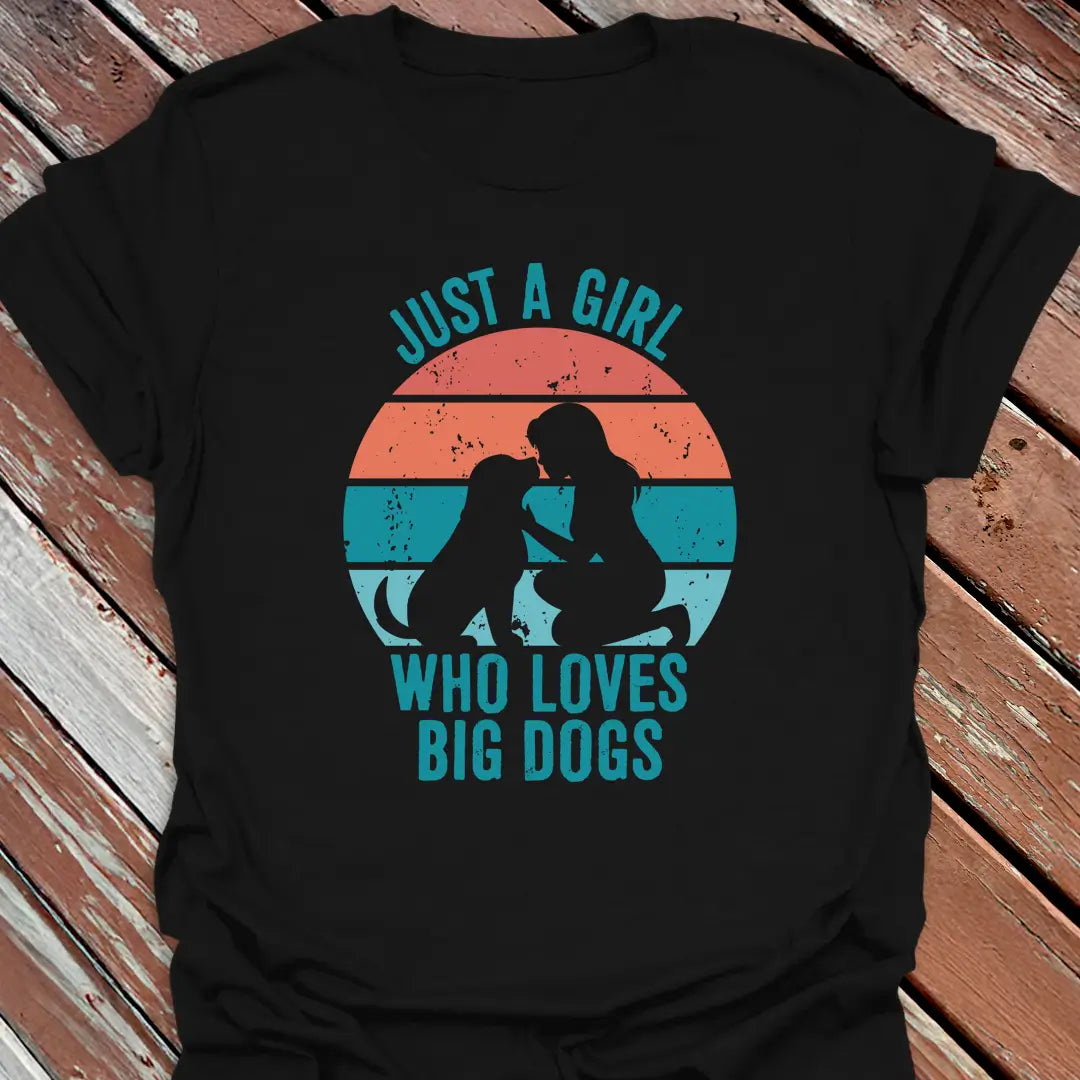 Black t-shirt with Just a Girl who loves big dogs design on a wooden surface