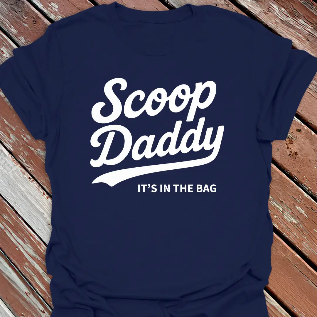 Big Woofer Wear navy “Scoop Daddy” T-shirt for big dog dads, bold scoop and paw design on wood background