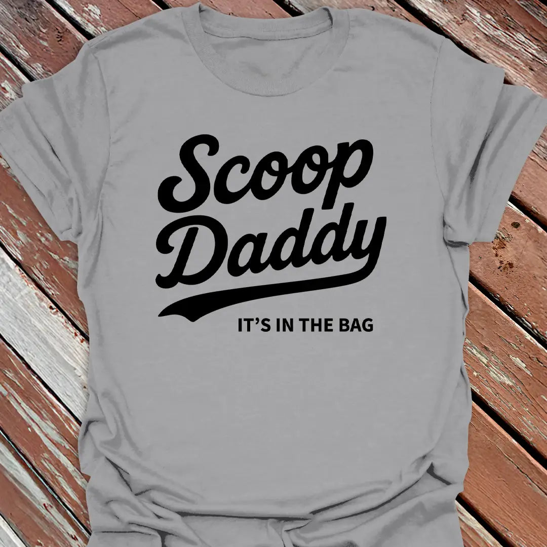 Big Woofer Wear sport grey “Scoop Daddy” T-shirt for big dog dads, bold scoop and paw design on wood background